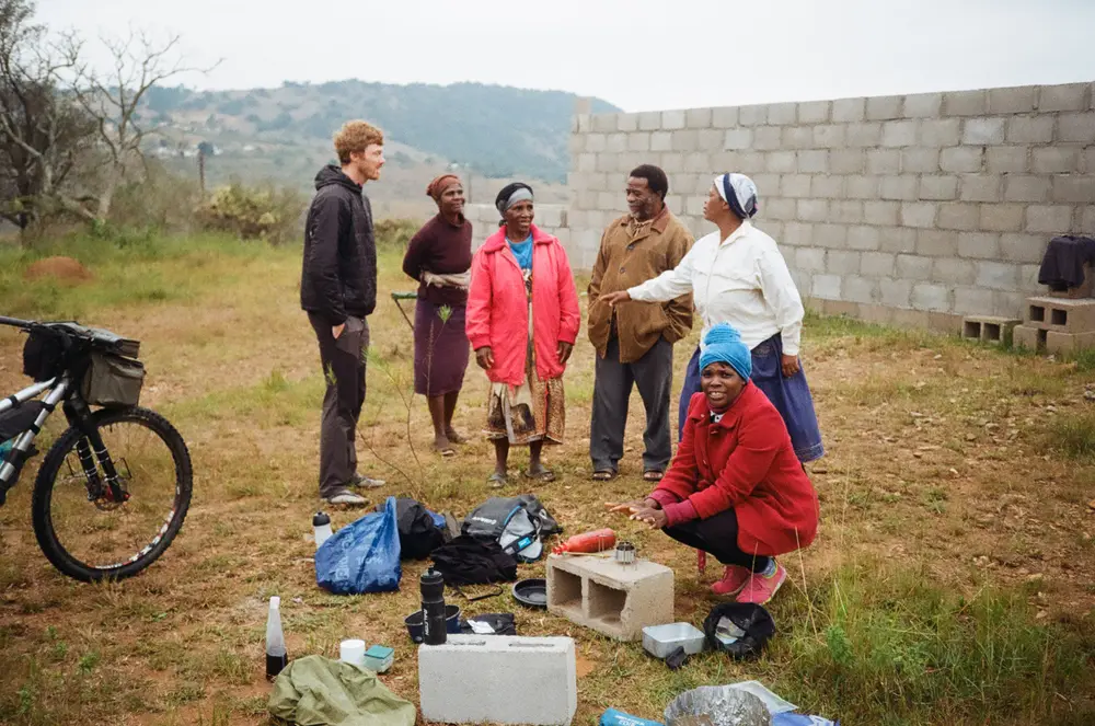 Curious locals come and say a welcoming hello as we had set up camp behind their soon-to-be new church.