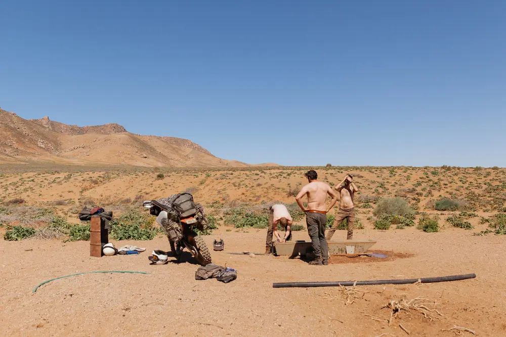 With little signs of water out here, we didn't miss a chance for a quick wash and cool down in this sheep's trough.