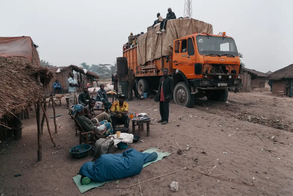 With the fear of falling off the roof or too bumpy to sleep inside, every unload stop was the only chance to catch a piece of sleep.