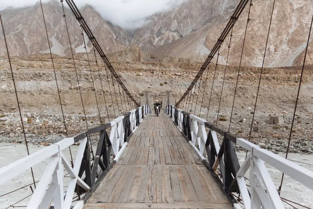 Along the highway, adjacent valleys run further into the mountains. The road along the Shimshal valley is a dramatic one, so we crossed the river and made our way to the small village at the end of the valley.