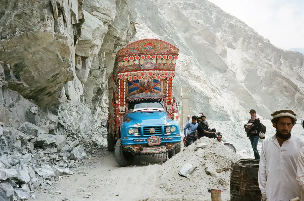 Hand painted and covered in decorations that jingle as they slowly pass over the rocky roads, before smothering you in a plume of black smoke.