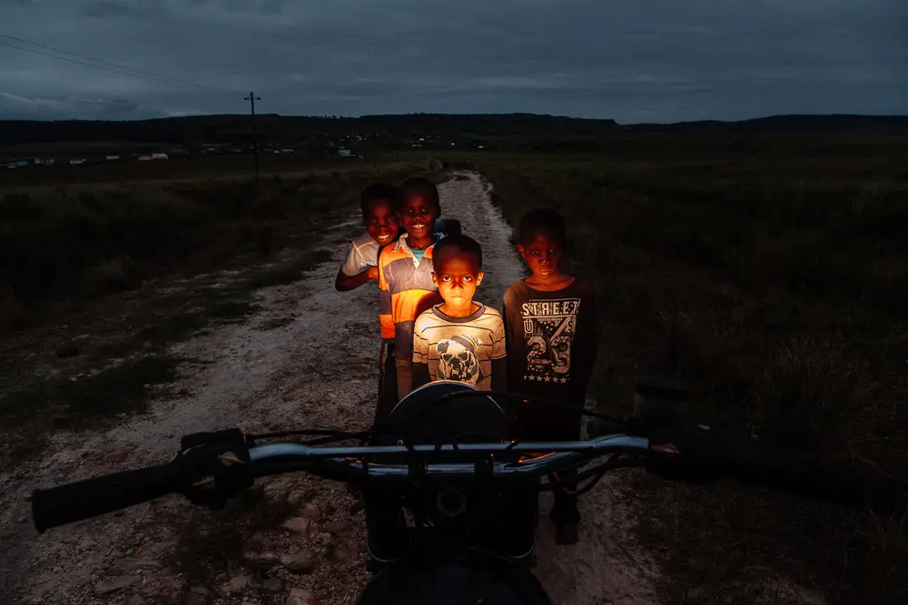 Children of the village didn't pass up the opportunity of a quick ride back to their house.