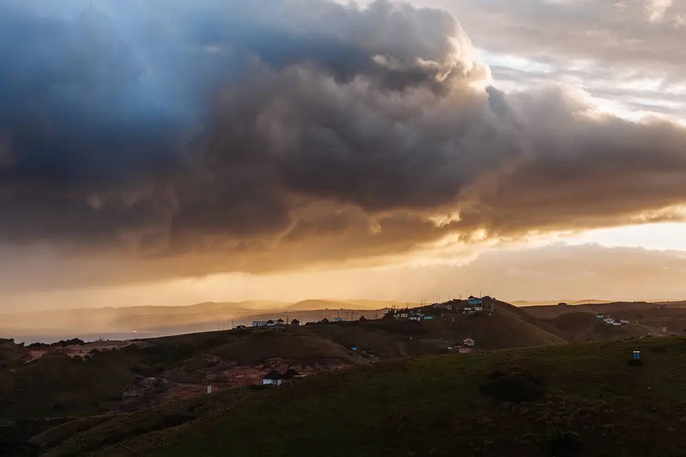 A storm rolls in across the village of Tshani.
